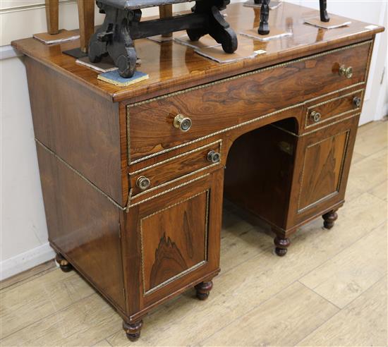 A rosewood desk W.108cm